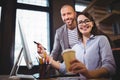 Happy coworkers working at computer desk Royalty Free Stock Photo