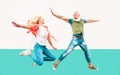 Happy crazy couple jumping together outdoor - Mature trendy people having fun celebrating and dancing outside