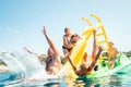 Happy crazy family hands up on floating Playground slide Catamaran as they enjoying sea trip as they have summer season vacation