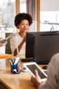 Happy creative female office worker with computer Royalty Free Stock Photo