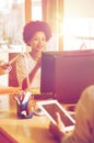 Happy creative female office worker with computer Royalty Free Stock Photo