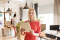 Happy creative female office worker with tablet pc Royalty Free Stock Photo