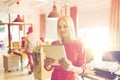 Happy creative female office worker with tablet pc Royalty Free Stock Photo