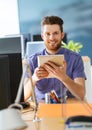 Happy creative male office worker with tablet pc Royalty Free Stock Photo