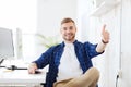 Happy creative man with computer at office Royalty Free Stock Photo