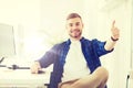 Happy creative man with computer at office Royalty Free Stock Photo