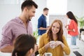 Happy creative team drinking coffee at office Royalty Free Stock Photo