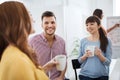 Happy creative team drinking coffee at office Royalty Free Stock Photo