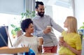 Happy creative team drinking coffee in office Royalty Free Stock Photo