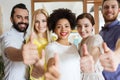 Happy creative team showing thumbs up in office Royalty Free Stock Photo