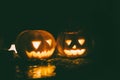 Happy and creepy traditional Halloween jack-o-lantern pumpkins