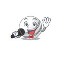 Happy cricket ball singing on a microphone