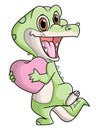 The happy crocodile is excited to celebrate the valentine `day