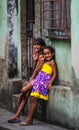 Happy Cuban girl capture portrait in poor colorful colonial alley with smile face, in old Havana, Cuba, America.