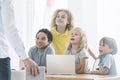 Students admiring computer science teacher