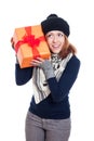 Happy curious winter woman with present