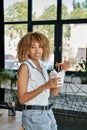 happy curly african american woman holding Royalty Free Stock Photo