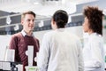 Happy customer talking with two helpful pharmacists in a contemp Royalty Free Stock Photo