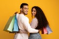 Happy Customers. Young Arab Couple With Shopping Bags Turning At Camera Royalty Free Stock Photo