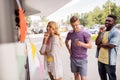 Happy customers queue at food truck