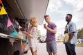 Happy customers queue at food truck Royalty Free Stock Photo