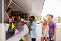 Happy customers queue at food truck Royalty Free Stock Photo