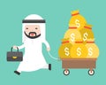 Happy Cute arab business man pulling cart which full with money