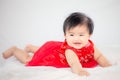 Happy cute asian baby girl in chinese tradition dress smiling Royalty Free Stock Photo