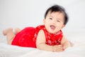 Happy cute asian baby girl in chinese tradition dress smiling Royalty Free Stock Photo