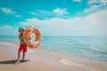 happy cute boy with floatie at tropical beach Royalty Free Stock Photo