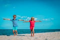 Happy cute boy and girl run play at beach Royalty Free Stock Photo