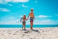 Happy cute boy and girl running at beach, kids play at sea Royalty Free Stock Photo