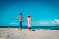 Happy cute boy and girl running on beach, kids play at sea Royalty Free Stock Photo