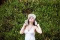 Happy cute brunette woman in park on summer day. Cheerful beautiful woman Royalty Free Stock Photo