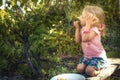 Happy cute child girl eating fresh fruits in summer garden concept healthy eating countryside lifestyle Royalty Free Stock Photo