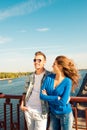 Happy cute couple in love embracing each other on the bridge Royalty Free Stock Photo