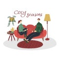 Happy cute couple sit on sofa in living room. Romantic man and woman enjoy weekend. Two people in cozy home. Family