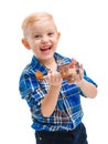 Happy cute baby boy playing with a toy airplane and laughing cheerfully. Isolated on white. Royalty Free Stock Photo