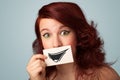 Happy cute girl holding paper with funny smiley drawing Royalty Free Stock Photo