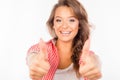 Happy cute girl showing thumbs up and smiling Royalty Free Stock Photo