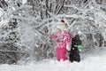 Kid walking and playing in snowy winter forest, winter wonderland, family travel Royalty Free Stock Photo