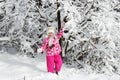 Kid walking and playing in snowy winter forest, winter wonderland, family travel Royalty Free Stock Photo