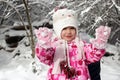 Kid walking and playing in snowy winter forest, winter wonderland, family travel Royalty Free Stock Photo