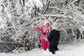 Kid walking and playing in snowy winter forest, winter wonderland, family travel Royalty Free Stock Photo