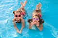 Happy cute girls in swimming pool