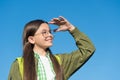 Happy cute kid in eyeglasses look ahead sunny blue sky outdoors, future Royalty Free Stock Photo