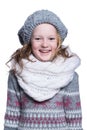 Happy cute kid posing in the studio isolated on white background. Wearing winter clothes. Knitted woolen sweater, scarf, hat Royalty Free Stock Photo