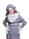 Happy cute kid posing in the studio isolated on white background. Wearing winter clothes. Knitted woolen sweater, scarf, hat. Royalty Free Stock Photo