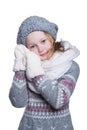 Happy cute kid posing in the studio isolated on white background. Wearing winter clothes. Knitted woolen sweater, scarf, hat and Royalty Free Stock Photo