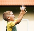 Happy cute kid with soap bubble